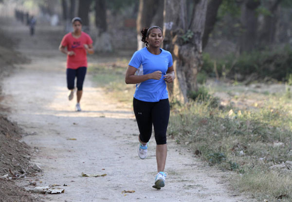 As Geeta Phogat completes her sprint at a sprawling sports campus in Punjab state, one of her coaches nods approvingly at her stopwatch, another rushes to check her pulse, and a third ushers her toward the gym for a bout of wrestling. Grappling with gender bias, Geeta heads to London