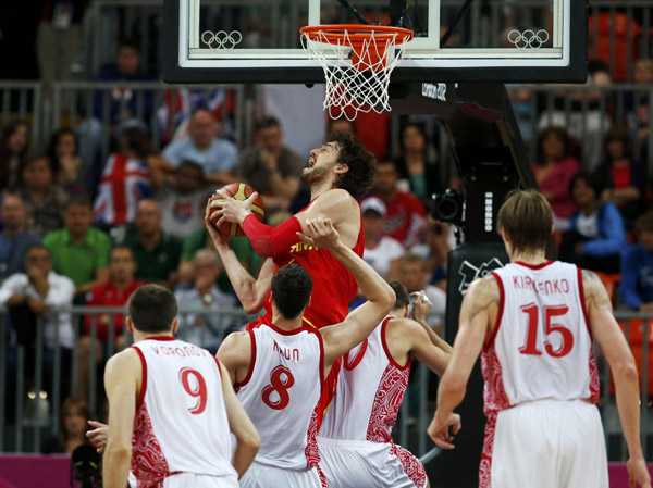 Spain's Pau Gasol grabs a rebound in his game against Russia during their men's basketball preliminary round, Group B match at the Basketball Arena during the London 2012 Olympic Games August 4, 2012. Russia beats Spain in men's basketball