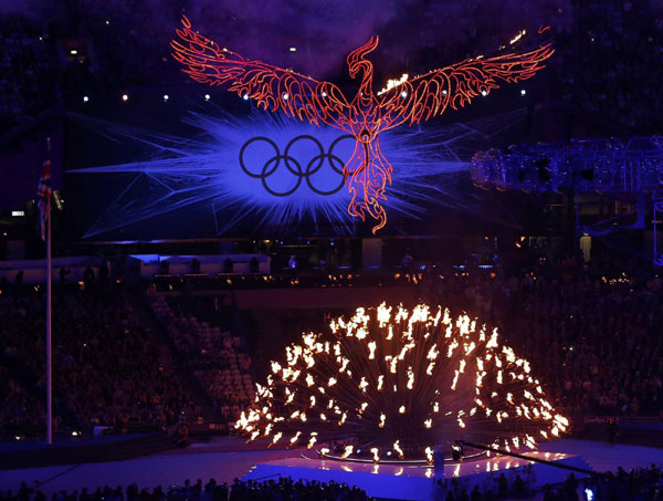 A flaming phoenix flies above the Olympic flame during the closing ceremony of the London 2012 Olympic Games at the Olympic Stadium August 12, 2012. Games over, time to party