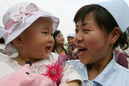 Quake babies reunite with nurse rescuers one year on