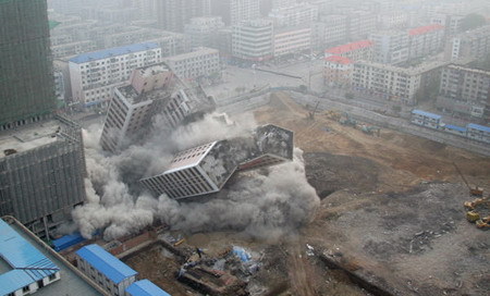 Once landmark tower brought down in planned explosion