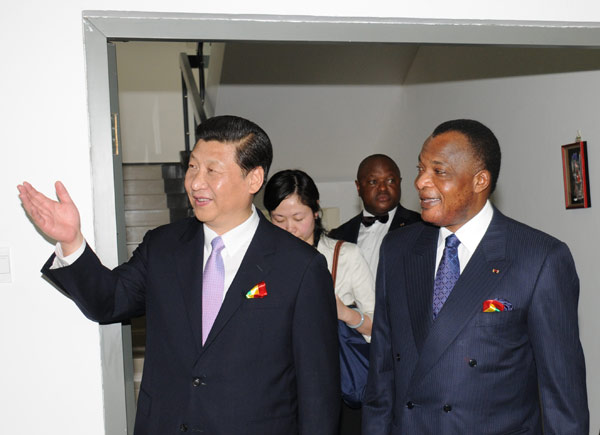 President Xi Jinping and the Republic of Congo's President Denis Sassou Nguesso visit a newly opened Chinese-built library at the University Marien Ngouabi in Brazzaville. China pledges support