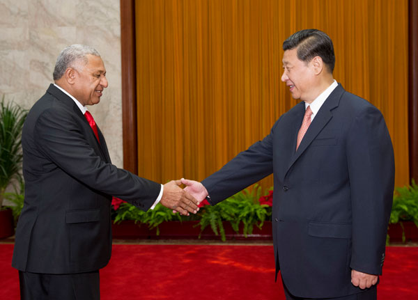 President Xi Jinping shakes hands with Fiji's Prime Minister Josaia V. Bainimarama (L) during a meeting at the Great Hall of the People in Beijing, May 29, 2013. President Xi meets Fiji prime minister