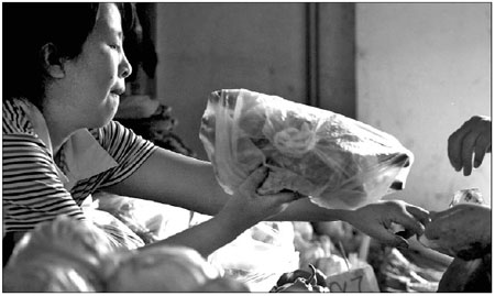 Despite problems, ban on free plastic bags is paying off