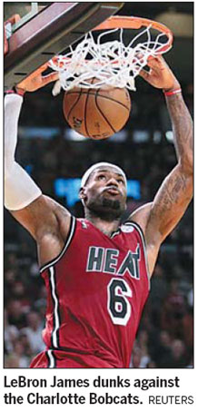James scores 31, Bosh adds 23 as Heat beat Bobcats