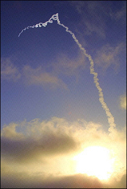 A modified Minuteman II missile -or 'target vehicle'- leaves a vapor trail across the sky shortly after lift off from Vandenberg Air Force Base, CA, to be intercepted by a 'kill vehicle' missile launched off of the Marshall Islands in the South Pacific. The Canadian government will not participate in the United States' plans to deploy a missile defense shield covering North America, Canadian foreign minister Pierre Pettigrew said.(AFP/DOD-HO/File) 