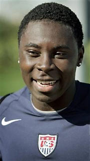 Wearing a U.S. soccer team practice jersey, Freddy Adu, 16, talks with reporters after a training session for the U.S. men's national soccer team