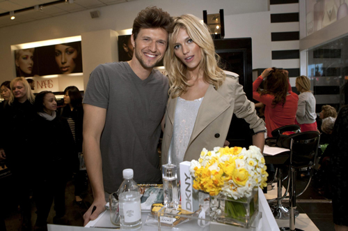 Rubik signs a poster in Sephora store in Time Square