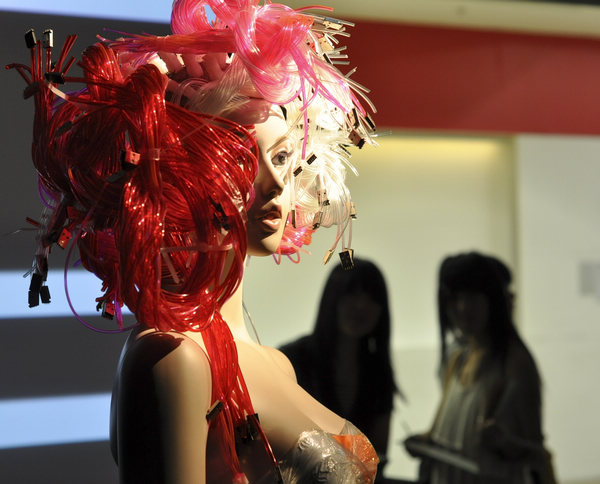 A dummy is decorated with a hairstyle creation exhibited in Taipei, Southeast China's Taiwan, May 21, 2011. Replacing the real hair, hair stylists presented their offbeat creations made of plants, magazine paper, plastic tubes and cloth here. Offbeat hairstyle creations presented in Taipei