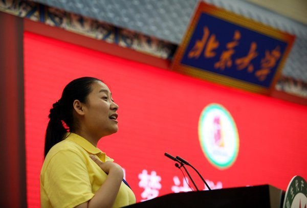 A migrant worker, a prospect of Peking University's “Realizing Dreams: 100' scheme, speaks during a ceremony to launch Peking University’s migrant-workers distance-learning programme in Guangdong Zhuhai Hotel on May 22,2011. Migrant workers realize university dreams