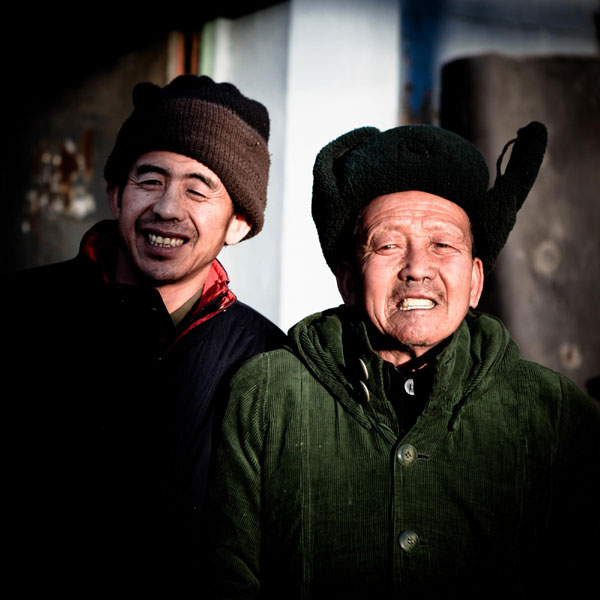 Ma Jiang and Ma Runlin, a father and a son who have disabilities and live on collecting garbage in Zhangjiakou city, Hebei province. Good Samaritans of 2012