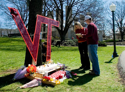 Virginia Tech students sign a book in memory of those killed on the campus of Virginia Tech in Blacksburg, Virginia, April 17, 2007. A student from South Korea was the gunman who killed 32 people at Virginia Tech university, police said on Tuesday. They gave no motive for the worst shooting rampage in U.S. history.