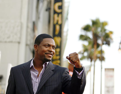 Cast member Chris Tucker gestures at the premiere of