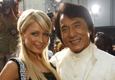 Cast member Jackie Chan (R) poses with Paris Hilton at the premiere of