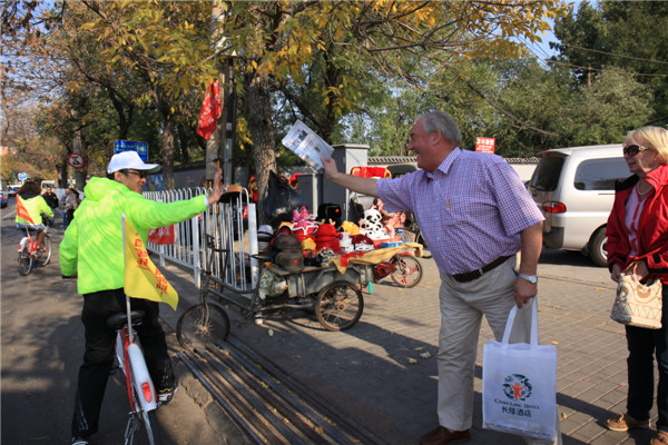 Beijing cycling tour promotes China Daily