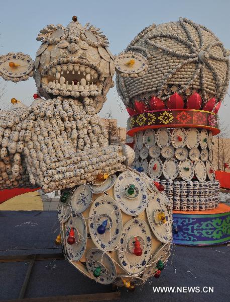 Statues made from procelain tableware exhibited in N China