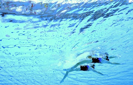Anastasia Davydova and Anastasia Ermakova of Russia compete in the final of the duet free routine of the synchronized swimming during the Beijing 2008 Olympic Games at the National Aquatic Center, or the Water Cube, in Beijing, China, Aug. 20, 2008. Anastasia Davydova and Anastasia Ermakova of Russia won the gold medal. 