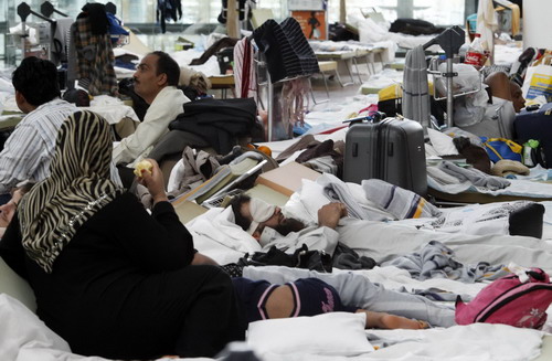 Stranded passengers wait at major Europe airports