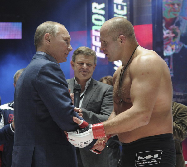 Putin attends MMA event, gets jeered
