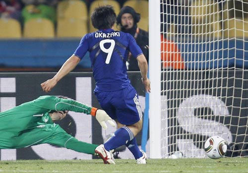 Japan reach last 16 with win over Denmark