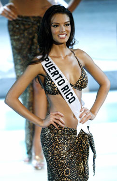 Miss Puerto Rico Zuleyka Rivera Mendoza takes her place on stage after being named a semi-finalist during the Miss Universe 2006 Pageant at the Shrine Auditorium in Los Angeles July 23, 2006. [Reuters]