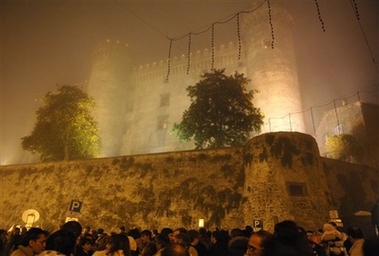 A night view of the 15th century Odescalchi Castle enveloped by fog, in the lakeside town of Bracciano some 43 kilometers (27 miles) from Rome, Saturday, Nov. 18, 2006. In a fairy-tale setting fit for royalty, U.S. actor Tom Cruise and U.S. actress Katie Holmes exchanged wedding vows Saturday evening in the 15th-century castle in central Italy. (AP 