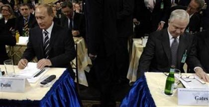 U.S. Defence Secretary Robert Gates and Russian president Vladimir Putin take their seats at the Bayerischer Hof hotel prior the 43rd Conference on Security Policy in Munich, February 10, 2007. Gates on Sunday dismissed as the blunt talk of an old spy accusations by Russian President Vladimir Putin that the United States sought to force its will on the world. (Defense Dept. photo/Cherie A. Thurlby/Handout/Reuters) 